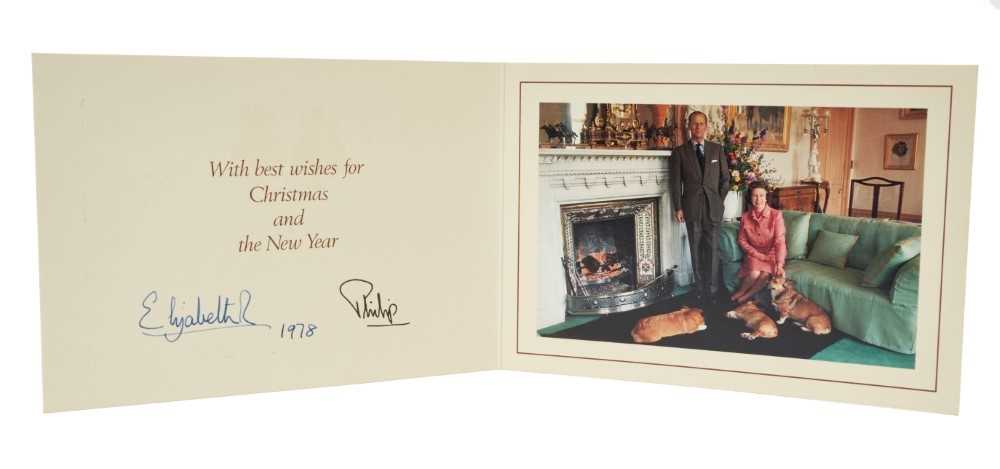Lot 43 - H.M.Queen Elizabeth II and H.R.H. The Duke of Edinburgh, signed 1978 Christmas card with twin gilt Royal ciphers to cover and colour photograph of the Royal couple with their corgis to interior