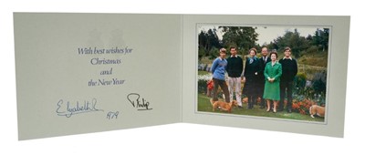 Lot 44 - H.M.Queen Elizabeth II and H.R.H.The Duke of Edinburgh, signed 1979 Christmas card with twin gilt Royal ciphers to cover, colour photograph of the Royal Family with dogs to the interior