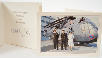 Lot 47 - H.M.Queen Elizabeth II and H.R.H.The Duke of Edinburgh, two signed 1982 and 1983 Christmas cards with twin gilt Royal ciphers to interiors and colour photographs of the Royal Family to fronts (2)