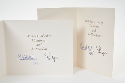 Lot 50 - H.M.Queen Elizabeth II and H.R.H.The Duke of Edinburgh, two signed 1988 and 1989 Christmas cards with twin gilt Royal ciphers to interiors and colour photographs of The Queen and Queen mother with...