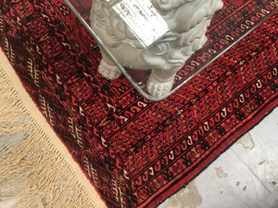 Lot 1244 - Decorative glass coffee table, with rectangular top on dog of foo ceramic supports