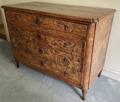 Lot 1257 - Impressive early 18th century Italian figured walnut crossbanded and marquetry inlaid commode, the top with shaped angles, over four drawers, each with early paper lining, on tapered feet, a note i...