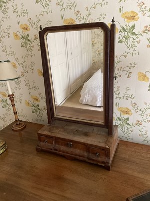 Lot 1425 - George II walnut dressing table mirror, with bevelled swing plate and three drawers to the platform base, 42cm wide