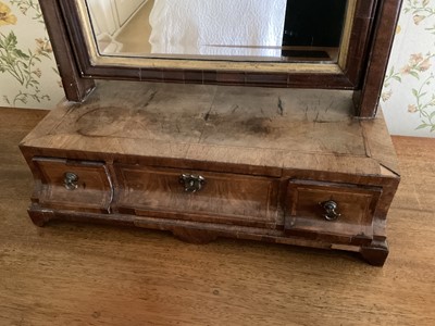 Lot 1425 - George II walnut dressing table mirror, with bevelled swing plate and three drawers to the platform base, 42cm wide