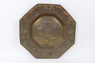 Lot 840 - 17th century style Dutch embossed brass charger, octagonal form with figural reserve and scrolling tulip border, 49cm wide