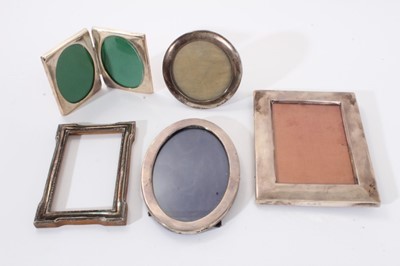 Lot 392 - Three Edwardian silver photograph frames, together with two others in silver plate