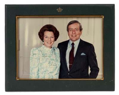 Lot 68 - H.M. Queen Beatrix of the Netherlands and H.R.H. Prince Claus of the Netherlands, signed 1980s presentation portrait photograph of the relaxed Royal Dutch couple.