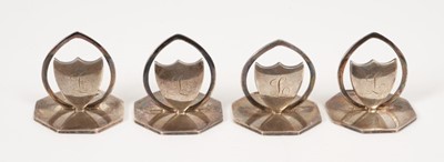 Lot 406 - George V set of four silver menu holders in the form of shields, with engraved initial L