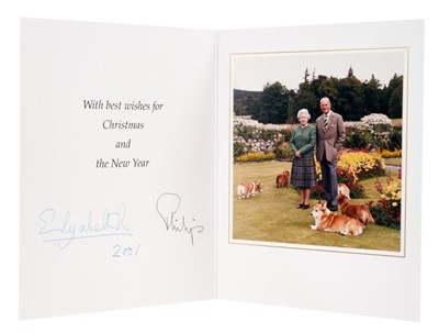 Lot 83 - H.M.Queen Elizabeth II and H.R.H. The Duke of Edinburgh, signed 2001 Christmas card with twin gilt Royal ciphers to cover and colour photograph of the Queen and Prince Philip with corgis to the int...