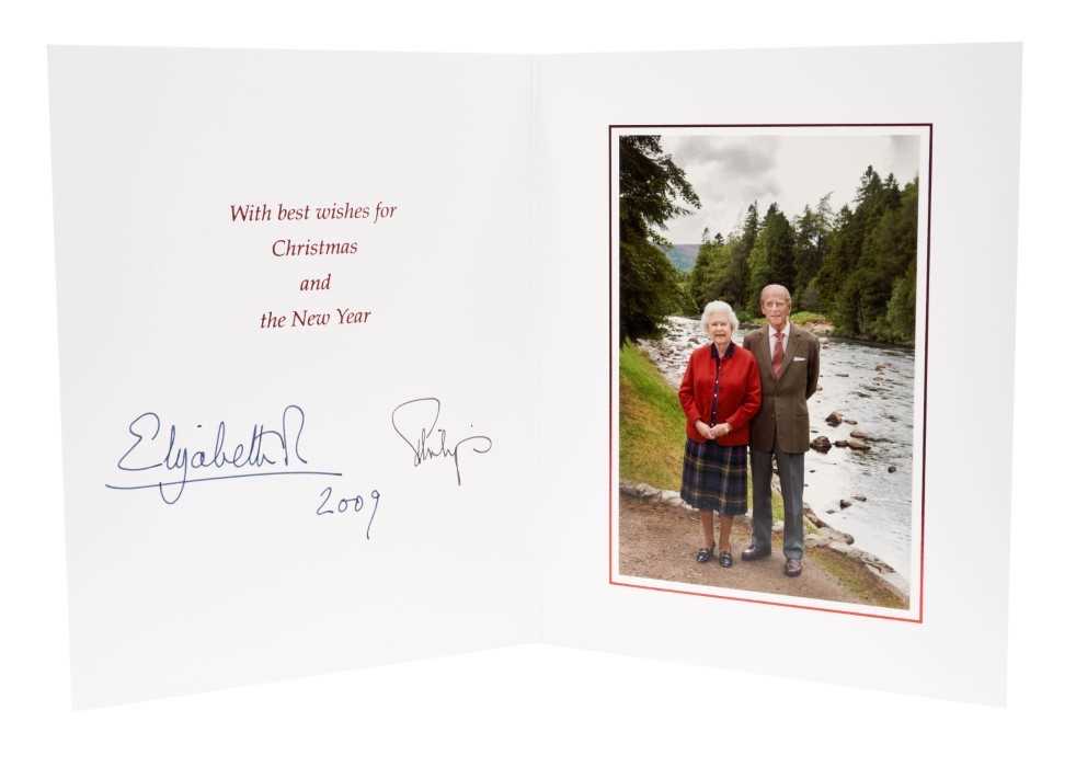 Lot 90 - H.M.Queen Elizabeth II and H.R.H. The Duke of Edinburgh, signed 2009 Christmas card with twin gilt Royal ciphers to cover and colour photograph of the Royal Couple to the interior- with envelope