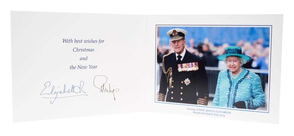 Lot 94 - H.M.Queen Elizabeth II and H.R.H. The Duke of Edinburgh, signed 2014 Christmas card with twin gilt Royal ciphers to cover and colour photograph of the Royal Couple at the naming of HMS Queen Elizab...