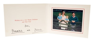 Lot 100 - T.R.H. The Prince and Princess of Wales, signed 1989 Christmas card with twin gilt Royal ciphers to cover and colour photograph of the Royal couple with their two young sons on a gate
