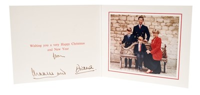Lot 101 - T.R.H. The Prince and Princess of Wales, signed 1991 Christmas card with twin gilt Royal ciphers to cover and colour photograph of the Royal couple with their two young sons on a bench