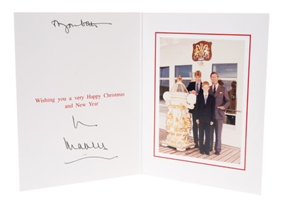 Lot 103 - H.R.H.The Prince of Wales, signed 1996 Christmas card with gilt Royal cipher to cover, colour photograph of Prince Charles with his two sons on board The Royal Yacht.