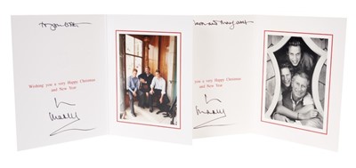 Lot 104 - H.R.H.The Prince of Wales, two signed 1990s Christmas cards each with gilt Royal ciphers , photographs of Prince Charles with his two sons to the interiors (2)