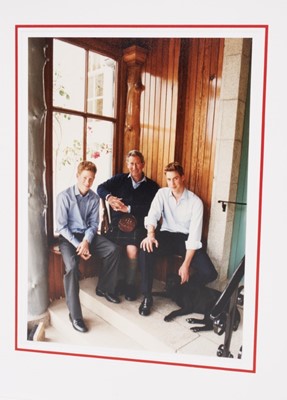 Lot 104 - H.R.H.The Prince of Wales, two signed 1990s Christmas cards each with gilt Royal ciphers , photographs of Prince Charles with his two sons to the interiors (2)