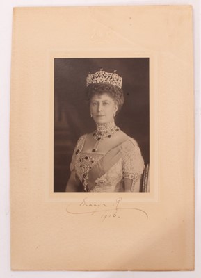 Lot 124 - H.M.Queen Mary, signed presentation portrait photograph of the Queen wearing jewels and The Order of The Garter, signed in ink on mount ' Mary R 1916'- un-framed 29 x 19 cm