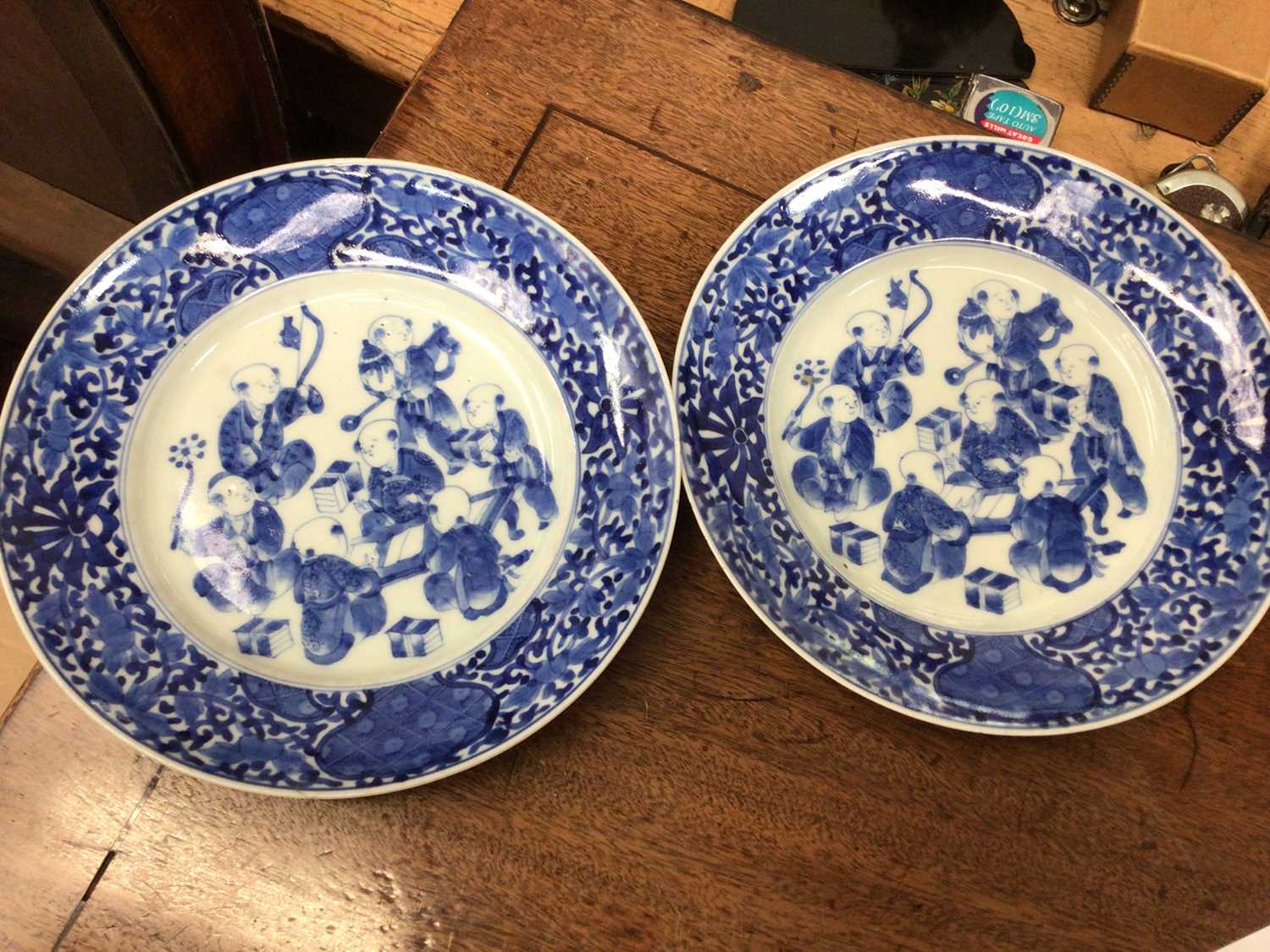 Lot 75 - Pair of blue and white Japanese plates depicting music and literature