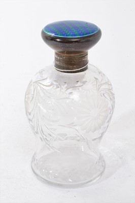 Lot 442 - 1920s silver amounted toilet water bottle with engraved decoration and blue enamelled cover