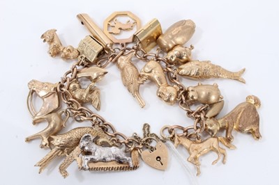 Lot 622 - 9ct gold charm bracelet with a collection of 9ct gold charms