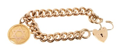 Lot 623 - A heavy 9ct gold curb link bracelet with padlock clasp and gold fob.