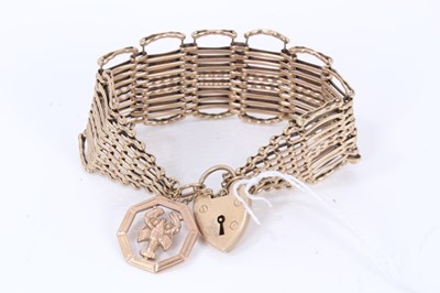 Lot 625 - 9ct gold gate bracelet with padlock clasp and gold fob