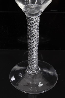 Lot 260 - 18th century wine glass with vine engraved bowl on air twist stem and splayed foot 14.4 cm