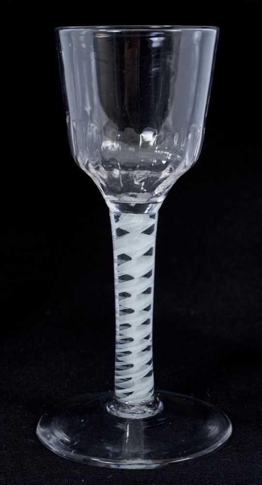 Lot 263 - 18th century wine glass with moulded bowl, double opaque twist stem on splayed foot 15cm