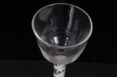 Lot 273 - 18th century wine glass with plain bowl, double opaque twist stem on splayed foot 15cm