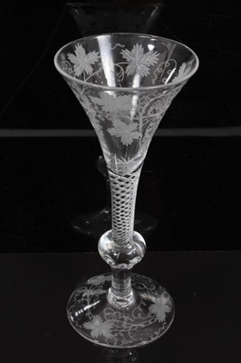 Lot 274 - Georgian-style wine glass with vine engraved decoration on air twist and knopped stem, ale flute with wrythern decoration and two other glasses (4)