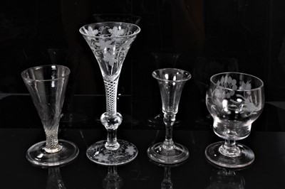 Lot 274 - Georgian-style wine glass with vine engraved decoration on air twist and knopped stem, ale flute with wrythern decoration and two other glasses (4)