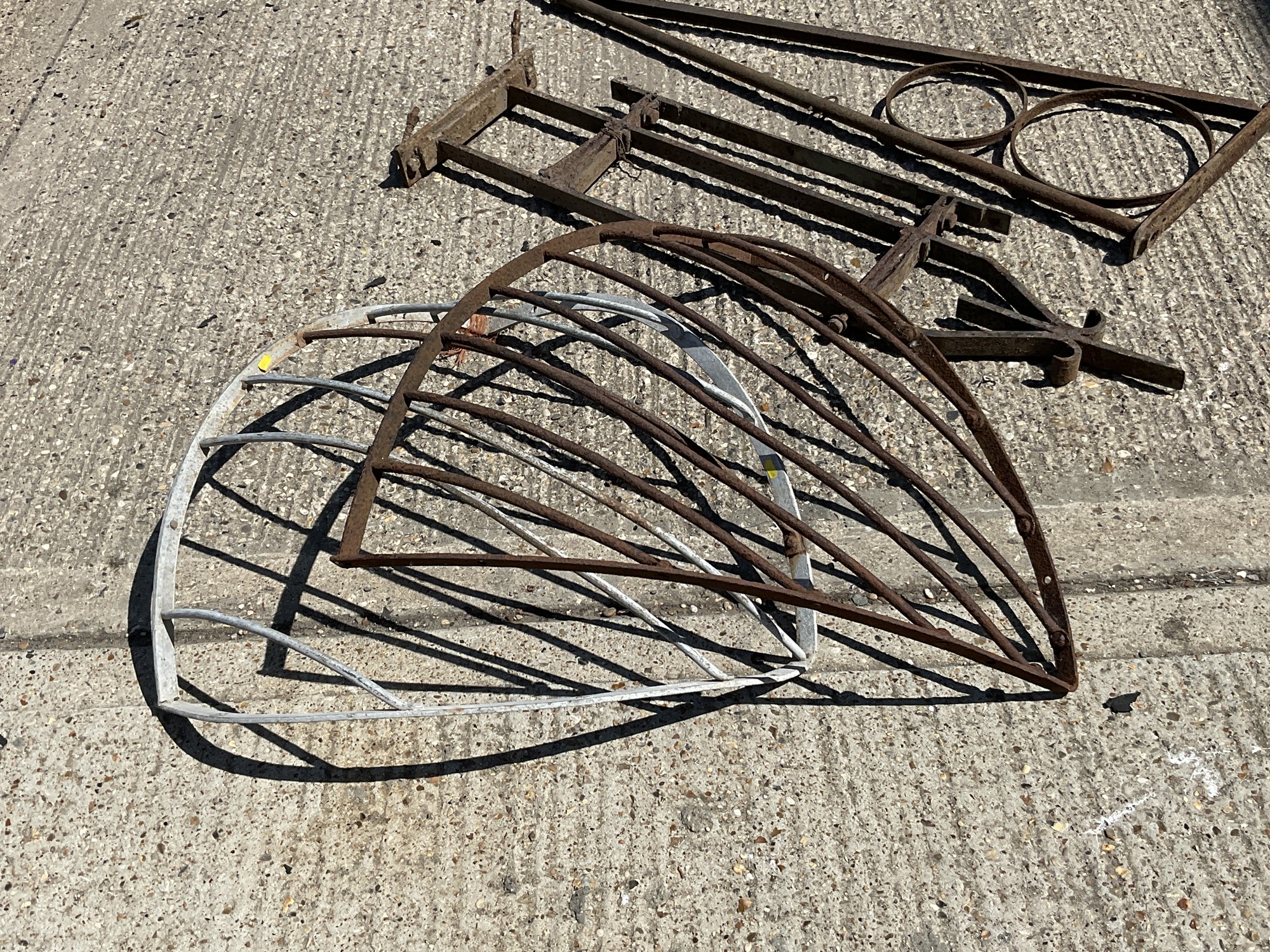 Lot 1329 Two 19th century iron swing sign brackets