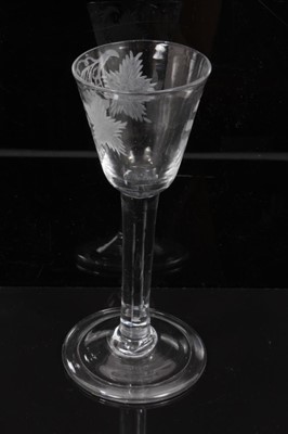 Lot 276 - 18th century wine glass with vine engraved bowl on plain stem on splayed folded foot 14.6cm high
