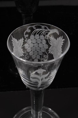 Lot 276 - 18th century wine glass with vine engraved bowl on plain stem on splayed folded foot 14.6cm high