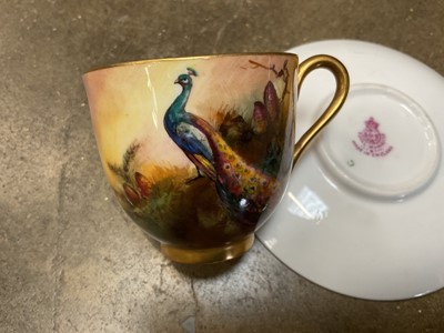 Lot 248 - Royal Worcester saucer dish painted by Harry Stinton with highland cattle, together with a Royal Worcester cup painted with peacocks