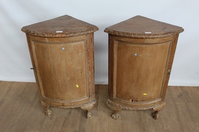 Lot 1036 - Pair of continental stripped pine corner bowfront cupboards