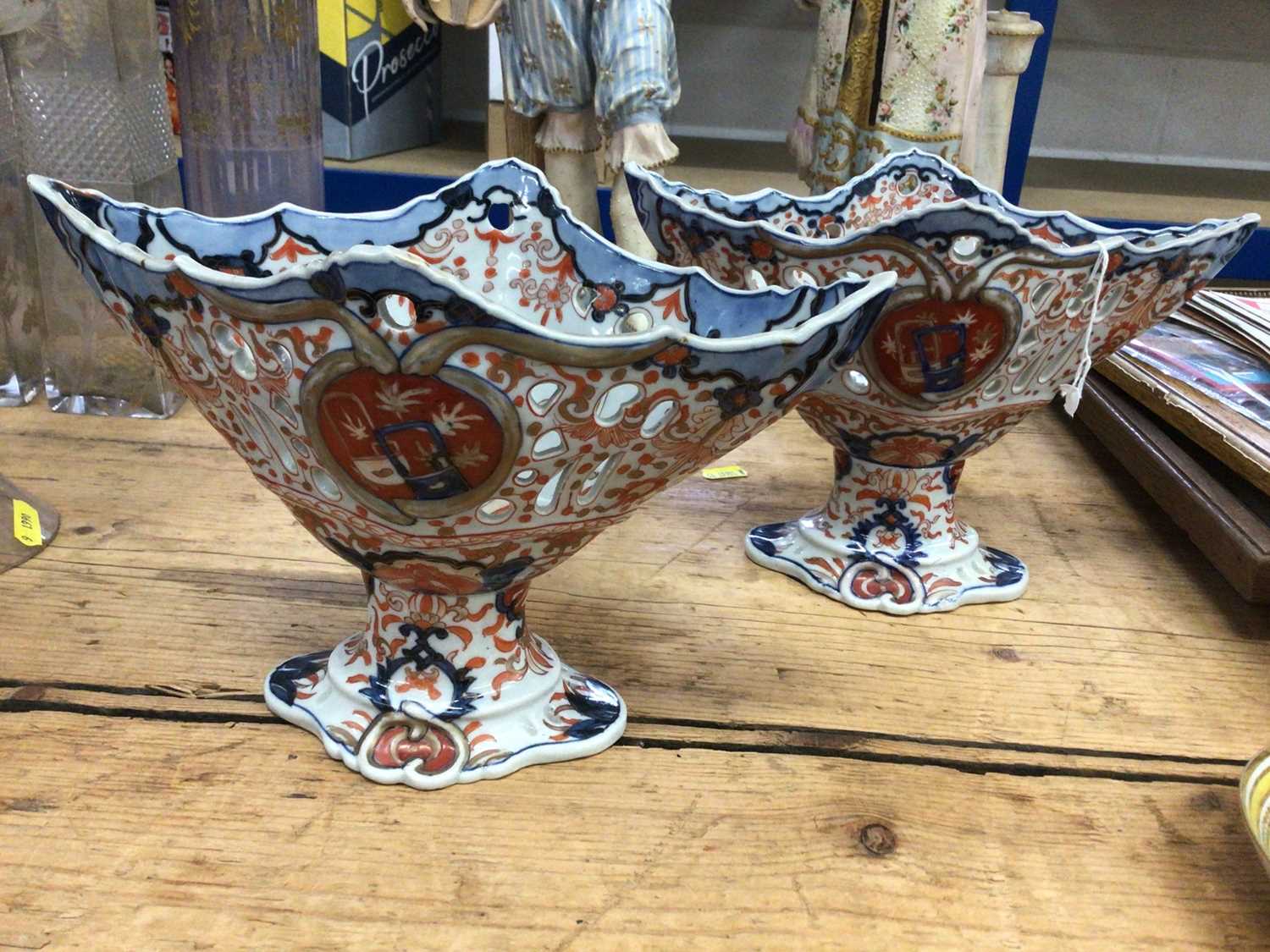 Lot 38 - Pair of Japanese Imari lozenge-shaped footed bowls, with pierced decoration, 18cm high