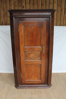 Lot 1439 - 18th century Anglo-French two height corner cupboard, with dentil cornice and geometric moulded panel door enclosing hanging space, 108cm wide x 62cm deep x 195cm high