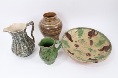 Lot 298 - Four pieces of 19th century pottery, including an agate ware jar, two sponge ware jugs, and a large Whieldon type dish