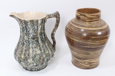 Lot 298 - Four pieces of 19th century pottery, including an agate ware jar, two sponge ware jugs, and a large Whieldon type dish