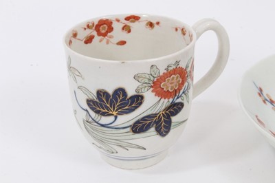 Lot 5 - A Worcester 'Kempthorne' coffee cup and saucer, circa 1770, polychrome painted with stylised flower sprays, pseudo-Chinese mark to bases, the saucer measuring 13cm diameter