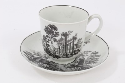 Lot 17 - A Worcester black-printed cup and saucer, circa 1760, decorated with classical ruins, the saucer measuring 12cm diameter