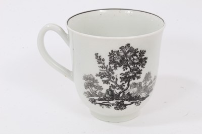 Lot 17 - A Worcester black-printed cup and saucer, circa 1760, decorated with classical ruins, the saucer measuring 12cm diameter