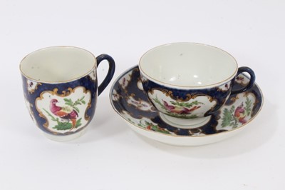 Lot 18 - Worcester trio, circa 1770, polychrome painted with tropical birds on a scale blue ground, W marks to bases, the saucer measuring 13cm diameter