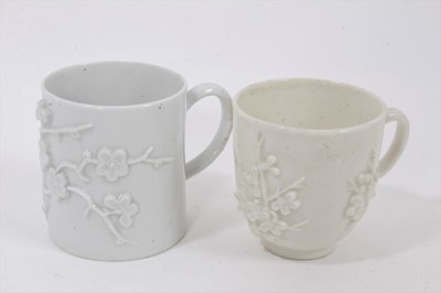 Lot 22 - A Bow blanc de chine cup and coffee can, circa 1750, both prunus moulded, 6cm and 6.25cm high