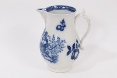Lot 28 - Worcester blue and white jug, circa 1780, printed in blue with the Parrot Pecking Fruit pattern, mask spout, crescent mark to base, 15cm high