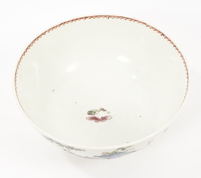 Lot 30 - An English porcelain bowl attributed to Vauxhall, circa 1755, polychrome painted in the Chinese style with flowers issuing from rockwork, 15cm diameter