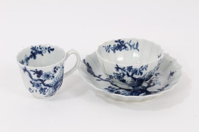 Lot 32 - A Worcester blue and white trio, circa 1758, decorated with the Prunus Root pattern, painter's marks to bases, the saucer measuring 13cm diameter
