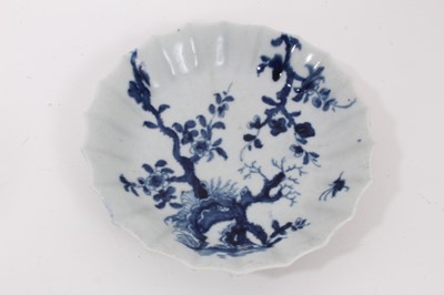 Lot 32 - A Worcester blue and white trio, circa 1758, decorated with the Prunus Root pattern, painter's marks to bases, the saucer measuring 13cm diameter