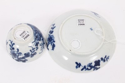 Lot 36 - A Worcester miniature blue and white teabowl and saucer, circa 1760, painted with the Prunus Root pattern, painter's marks, the saucer measuring 8.25cm diameter